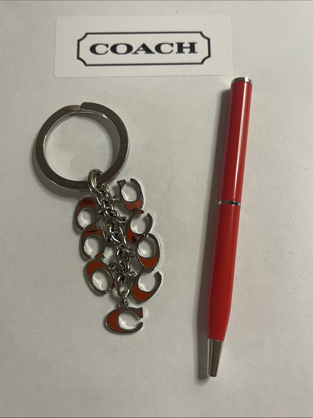 Coach Silver-Tone Keyring with Orange Enamel 'C' Charms